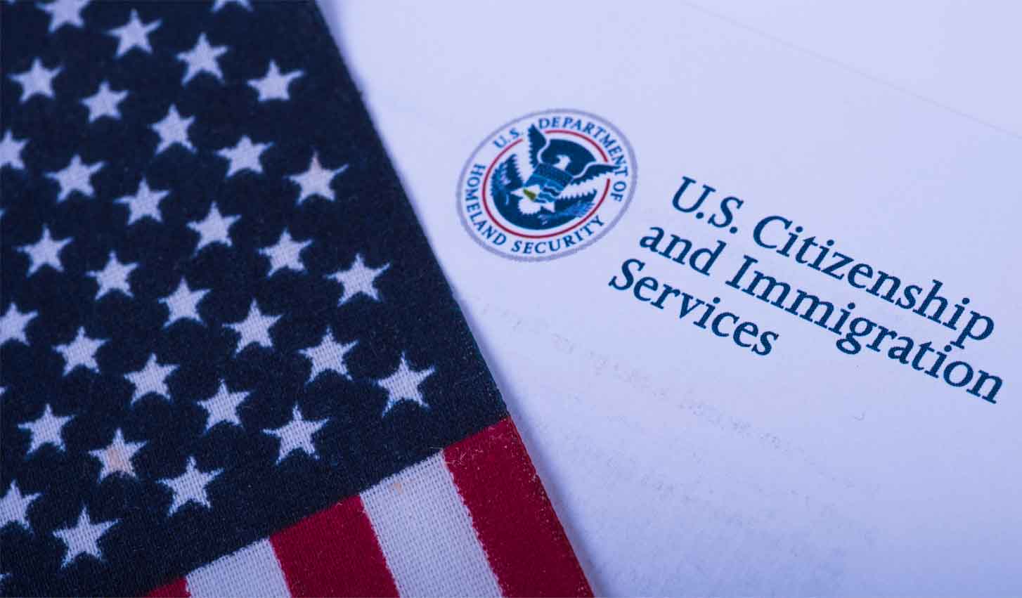 USCIS Logo and USA flag